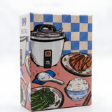 Jigsaw puzzle box with illustrations of a rice cooker and Japanese food on a checkered background