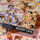 Jigsaw puzzle with 'Moody Cats' theme, partially completed with stickers.