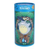 A cylindrical blue puzzle box featuring My Neighbor Totoro artwork with Totoro, a tree, and the title 'My Neighbor Totoro' on the top, shown on a plain white background.