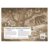 Cobble Hill Puzzle Company packaging with forest scene illustration