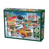Cobble Hill puzzle box featuring a festive drive-in theater scene with colorful cars and buildings.