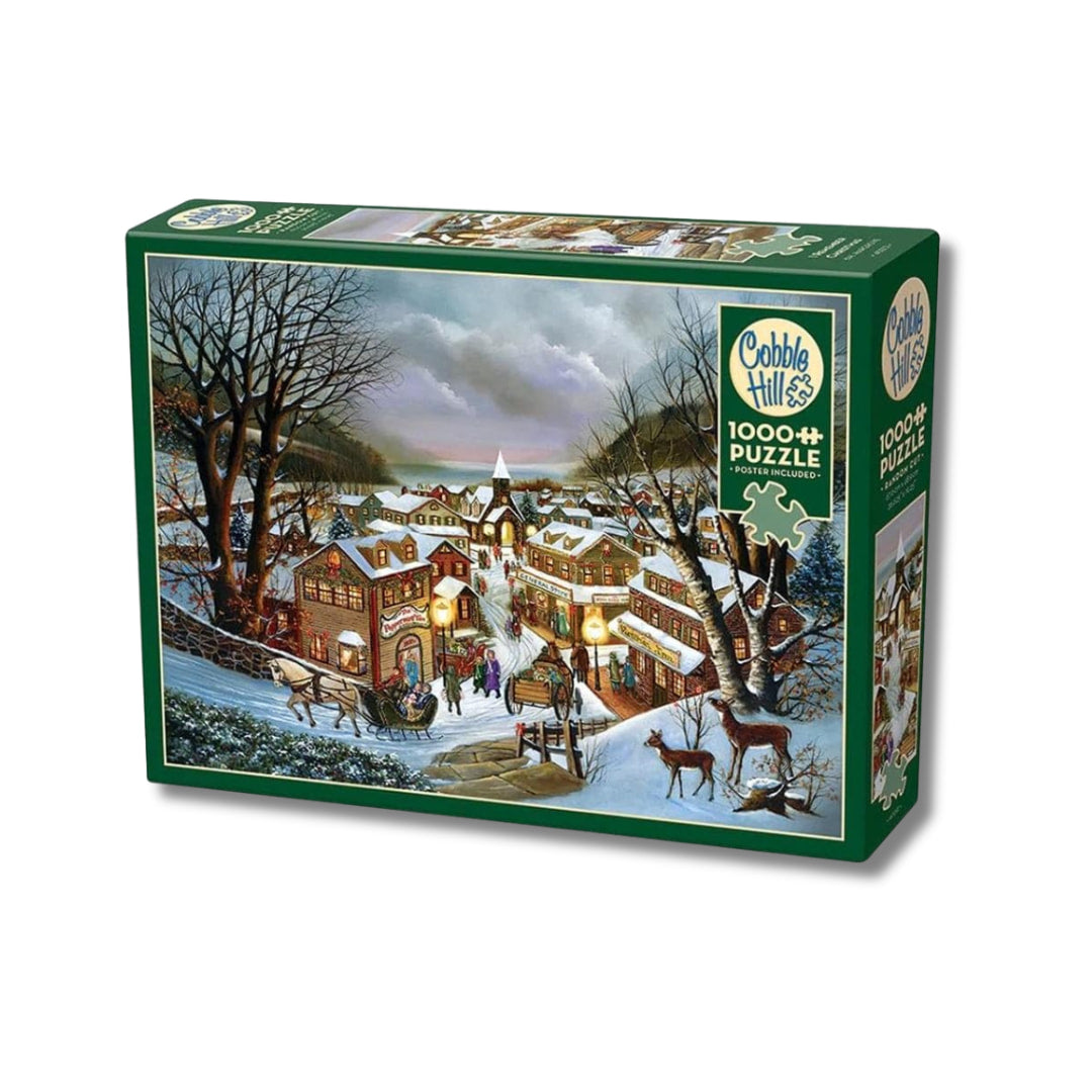 Cobble Hill puzzle box with a winter village scene on a white background
