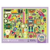 Cobble Hill puzzle packaging with colorful illustrations of toys and tools on a green background.