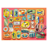 Collection of colorful vintage-style sardine can labels on a pink background