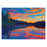 Colorful sunset over a lake with trees on the shore