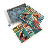 A completed and partially assembled jigsaw puzzle box set featuring a whimsical cat illustration under an orange-red umbrella, shown on a clean white background with loose puzzle pieces nearby.