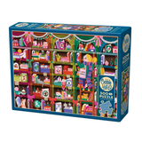A boxed jigsaw puzzle on a plain white background. The front of the box shows a colorful illustrated scene of shelves filled with holiday-themed items, stockings, ornaments, and gifts.