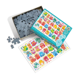 A colorful children's jigsaw puzzle set shown open with pieces scattered in a box, a completed puzzle sheet, and the illustrated puzzle box on a clean white background.