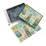 A completed jigsaw puzzle box shown with its open lid filled with dark blue puzzle pieces and a loose single piece on a white background. The puzzle cover features a colorful illustrated garden scene with plants, butterflies, flowers, and decorative panels.