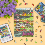 Jigsaw puzzle with a colorful design of a town, partially completed, on a yellow surface with flowers.