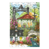 Garden-themed puzzle with colorful illustration of a gazebo, flowers, and people.