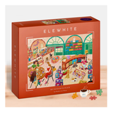 Elewhite puzzle box with illustration of a cozy café scene on a white background