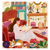 A completed jigsaw puzzle showing a cozy illustrated scene of a woman reading in a warmly decorated room, with a sleeping orange cat, books, shelves, and furniture. A circular 'ELEWHITE' brand logo appears in the lower-left corner.