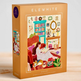 A 1000-piece jigsaw puzzle box by the brand ELE WHITE, titled 'Quiet Joy'. The box is a warm tan color with a colorful illustration of a cozy living room scene showing a woman reading accompanied by a cat.