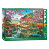 Jigsaw puzzle box featuring a Japanese garden scene with cherry blossoms and a pagoda.