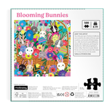 Jigsaw puzzle packaging with 'Blooming Bunnies' design featuring colorful bunnies and flowers.