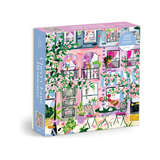 Jigsaw puzzle box with a colorful illustration of a street scene on a white background