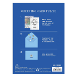 Greeting card puzzle packaging with instructions on a blue background