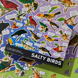 Jigsaw puzzle with bird illustrations and a box labeled 'Salty Birds' on a colorful background.