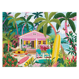 Colorful puzzle with a tropical scene featuring a pink house, palm trees, and outdoor furniture.
