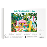 Jigsaw puzzle packaging with 'Surfside Bungalow' design featuring a beach house and palm trees.