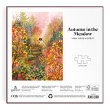 Puzzle box titled 'Autumn in the Meadow' with a colorful illustration of a  house in a forest.