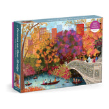 Jigsaw puzzle box with a colorful illustration of a bridge and park scene.