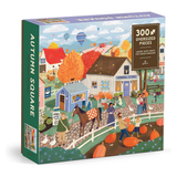 Autumn Square 300-piece jigsaw puzzle box featuring a colorful illustrated farm market scene with houses, people, pumpkins, and a horse.
