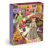 A boxed jigsaw puzzle titled "Cottage Cats" shown at a slight angle against a plain white background. The front and spine of the box feature a colorful illustrated scene of cats in a garden, with one cat sweeping and another pushing a wheelbarrow of mushrooms.