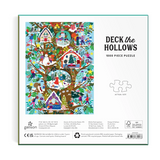 Back of the Galison Deck the Hollows 1000 Piece Puzzle box, featuring a colorful illustrated forest scene with houses, trees, and people, alongside product text and a puzzle piece outline icon on a white background.