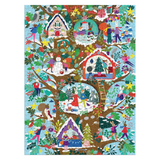 A completed jigsaw puzzle featuring a whimsical winter tree with multiple colorful treehouses, snow-covered branches, and playful figures in red, blue, yellow, green, and purple, set against a light blue background.