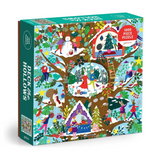 A 1000-piece jigsaw puzzle box titled 'Deck the Hollows' by Galison, featuring a highly detailed, colorful winter illustration of a tree with a treehouse, snowman, and festive characters.