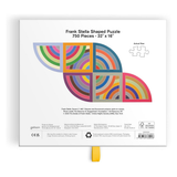 Back of a Frank Stella shaped jigsaw puzzle box on a white background, showing the puzzle design, piece count, dimensions, and product details. A small yellow tab hangs from the bottom.