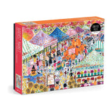An Image of Michael Storrings Harvest Market 1000 Piece Puzzle by Galison featuring a classic farmer's market bustling about on an Autumn's day. 