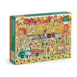 Puzzle box with an autumn-themed design featuring people at a pumpkin patch.