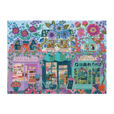 Colorful mosaic of a street scene with shops and flowers