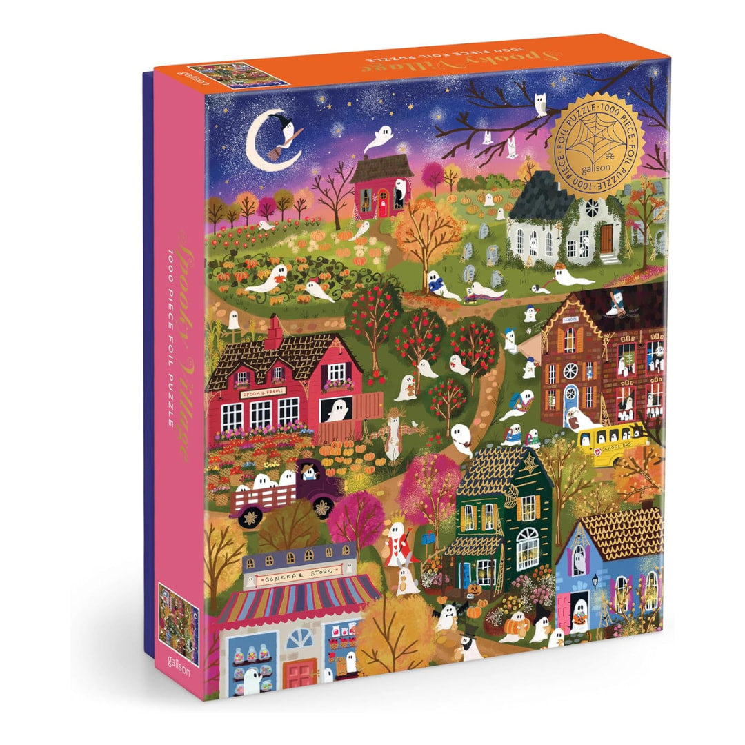 Joy Laforme Spooky Village 1000 Piece Puzzle box features an adorably ghostly village on a spooky Halloween night