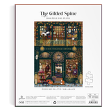 The Gilded Spine 1000-piece foil puzzle box by Galton, featuring an intricate illustration of a bookstore interior with shelves, books, and figures, set against a clean white background.