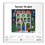 Front of the Twisted Twilly 'Twilight Toy Shop' 1000-piece jigsaw puzzle packaging, featuring a colorful illustration of a whimsical toy shop at night with a boy fixing a robot and a dog.