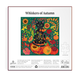 Square jigsaw puzzle box for 'Whiskers of Autumn' by Galison, featuring a colorful illustration of a black cat surrounded by pumpkins, sunflowers, and autumn leaves on a dark green background.