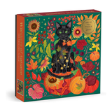 A 500-piece foil puzzle box titled 'Whiskers of Autumn' featuring a black cat surrounded by autumn leaves, pumpkins, and flowers on a dark teal background. The box is shown at an angle on a clean white background.
