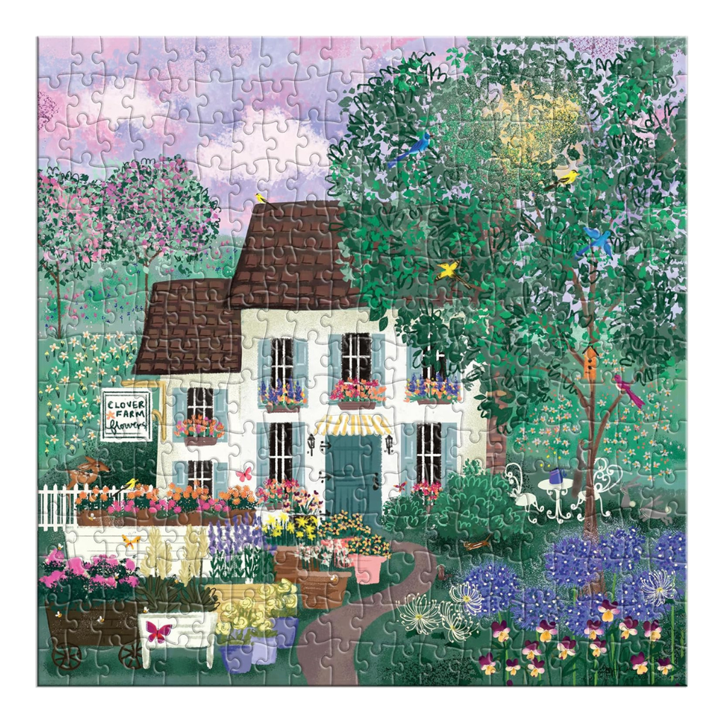 Jigsaw puzzle with a colorful scene of a house and garden