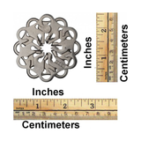 Decorative metal object with measurements in inches and centimeters