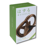 Box of Huzzle puzzle with green and white design