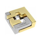 Gold and silver metal puzzle with 'Cross' branding on a white background