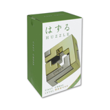 Huzzle puzzle packaging with green and white design on a white background