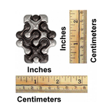 Metallic hand puzzle with measurements in inches and centimeters on a white background