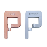 Two metal puzzle pieces, one rose gold and one silver, on a white background.