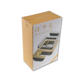 HUZZLE product packaging with gold accents on a white background