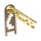 Gold and silver metal puzzle on a white background